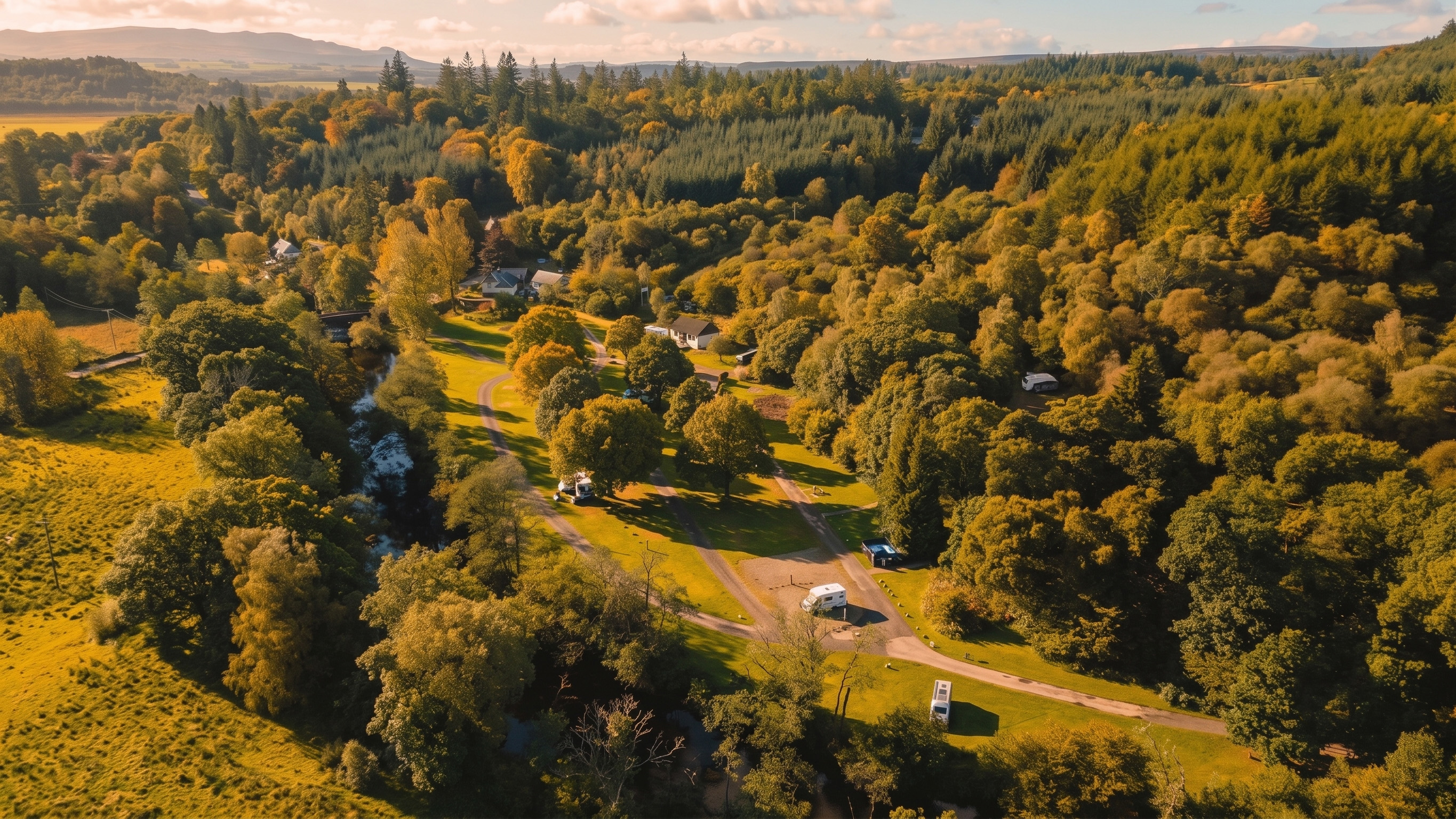 Luxury bell tent pitched under ancient oak canopy at Cobleland campsite Scotland