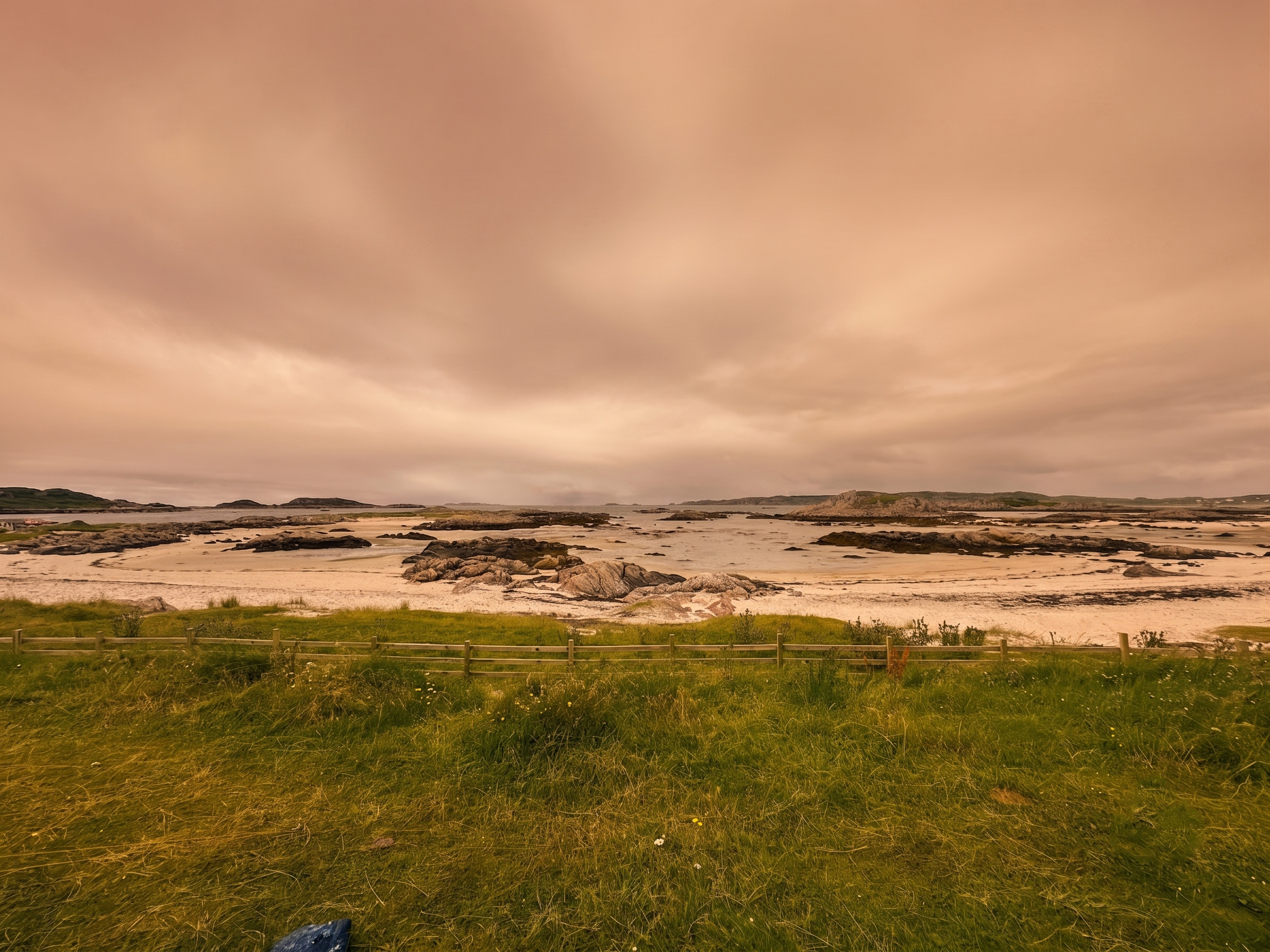 Coastal camping pitch along the scenic North Coast 500 route in the Scottish Highlands