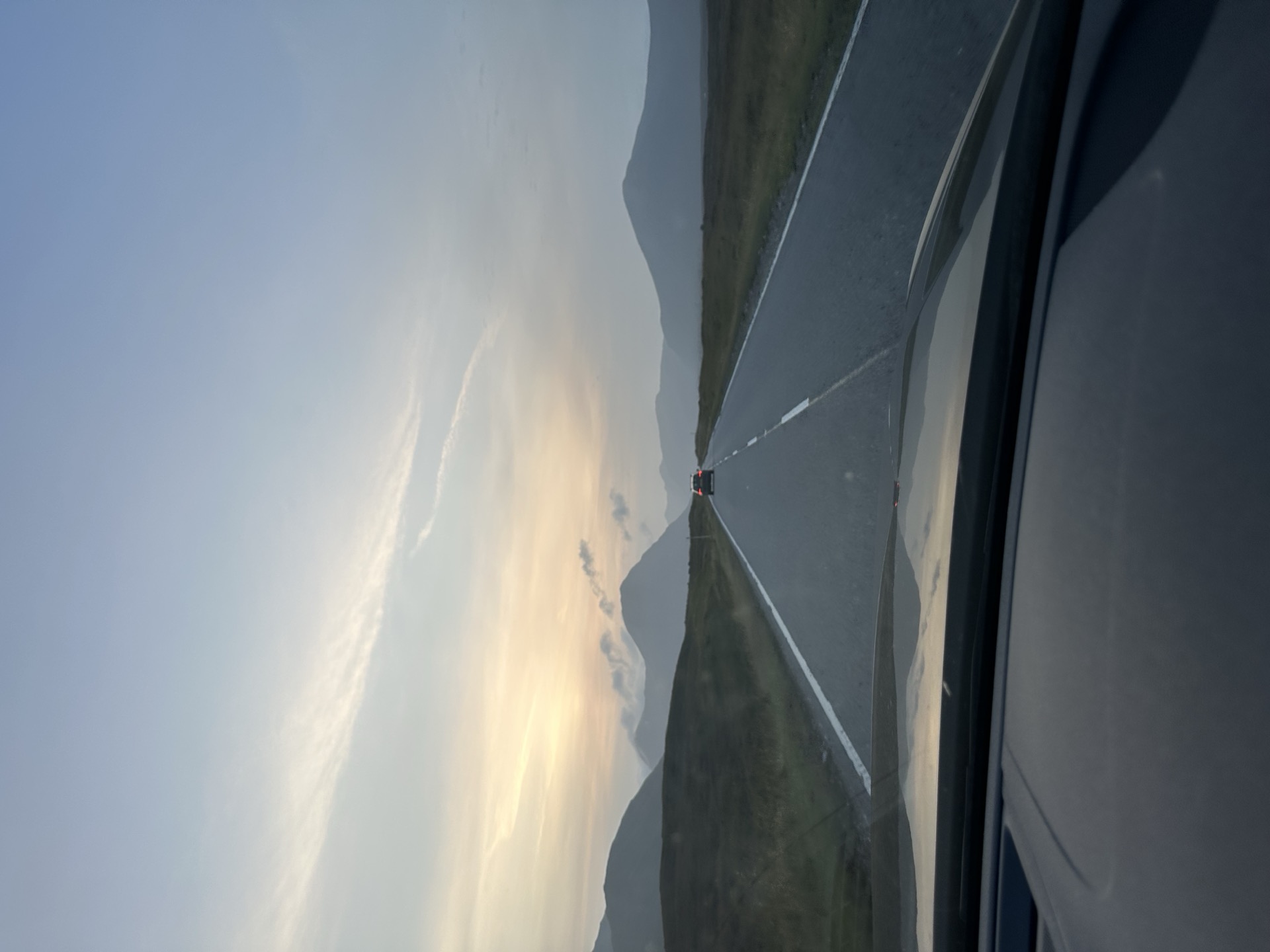 Dusk on the A82 heading into the Highlands, mountains ahead