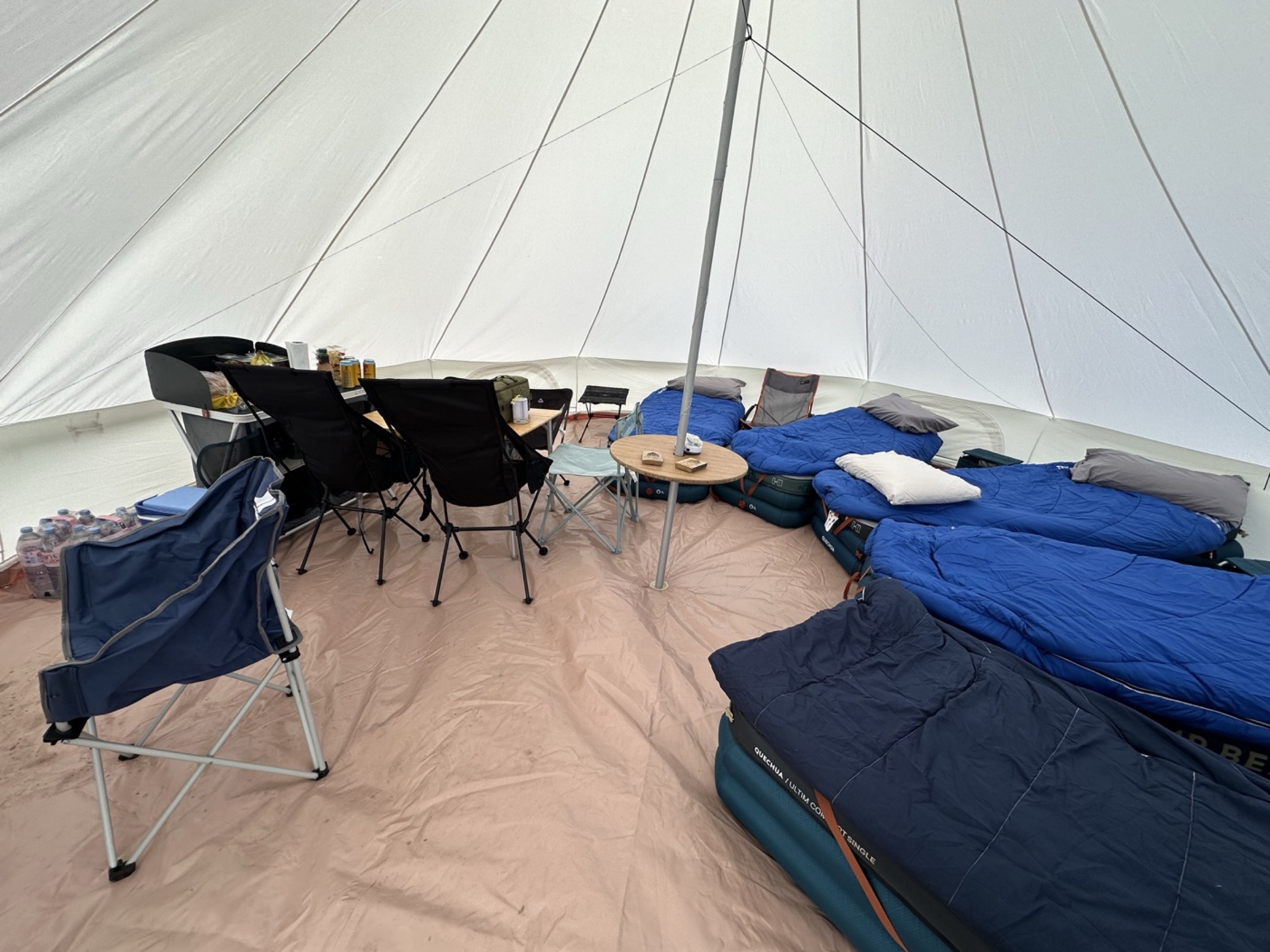 Airbeds and sleeping bags made up around the centre pole of the 6M bell tent